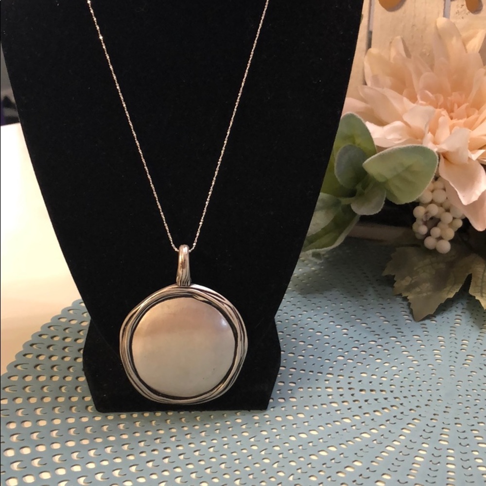 A vintage pewter style pendant